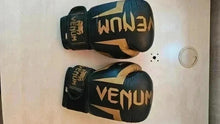 Load image into Gallery viewer, Boxing Gloves Venum in good condition. Black and gold color
